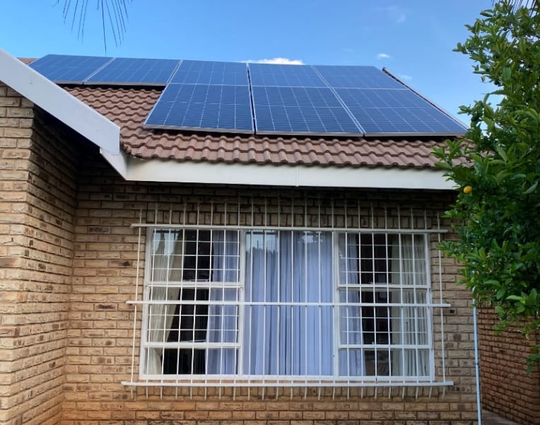 DH Solar and Electrical team installing rooftop solar panels for energy efficiency