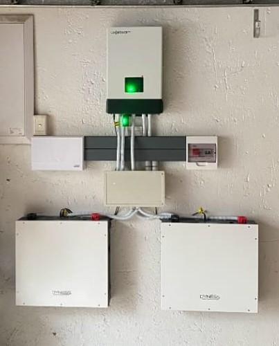 Professionally installed solar inverter and battery backup system, clean and well-maintained