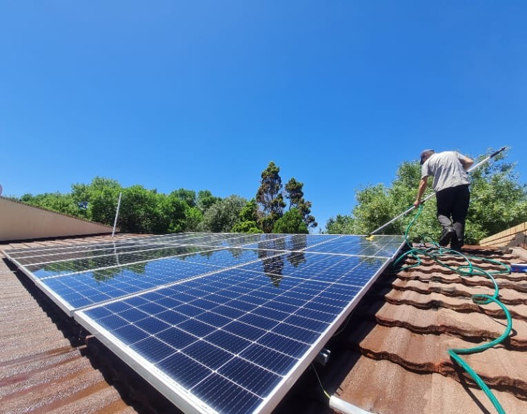 DH Solar and Electrical performing routine solar panel maintenance and cleaning