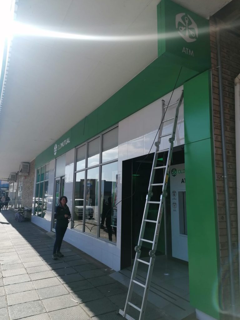 Repairing outdoor light on Old Mutual building in Parys