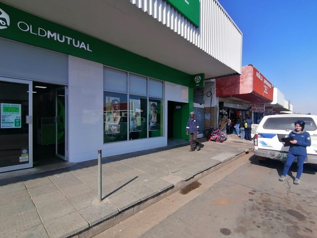 DH Solar and Electrical technician repairing exterior logo lighting in Parys