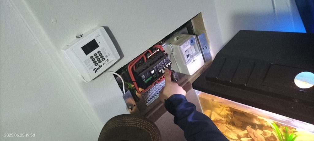 Electrician performing fault finding on a solar electrical system in Potchefstroom.